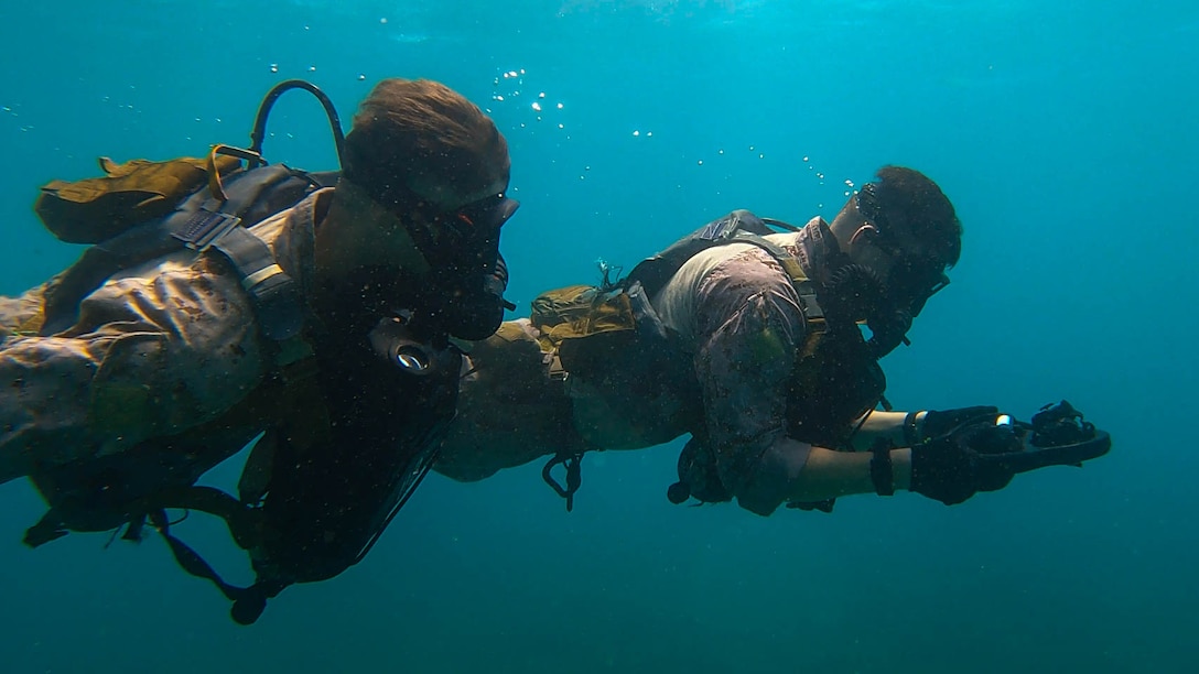 U.S. Marines with 2d Reconnaissance (Recon) Battalion, 2d Marine Division navigate through the water during Exercise Caribbean Coastal Warrior in Savaneta, Aruba, May 18, 2023. This bilateral training exercise allows 2d Recon to expand its knowledge and proficiency when operating in littoral and coastal regions. Caribbean Coastal Warrior continues to increase global interoperability between the U.S. Marines and the Dutch Marines as well as Caribbean Urban Warrior, an annual training evolution conducted on Camp Lejeune, North Carolina.(U.S. Marine Corps photo by Cpl. Cassidy Shepherd)