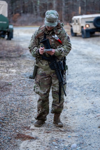 U.S. Air Force Tech. Sgt. Jessica Gallis, equipment manager with the 104th Logistics Readiness Squadron, competes in the 2023 Massachusetts National Guard Best Warrior Competition's land navigation event March 25, 2023 at Joint-Base Cape Cod, Massachusetts. The three-day competition covered areas of expertise to include physical fitness, weapons proficiency, land navigation, and first aid. (U.S. Air National Guard courtesy photo)