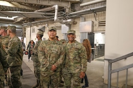 Staff Sgt. Jee Lee and Maj. Gen. Michel M. Russell Sr.