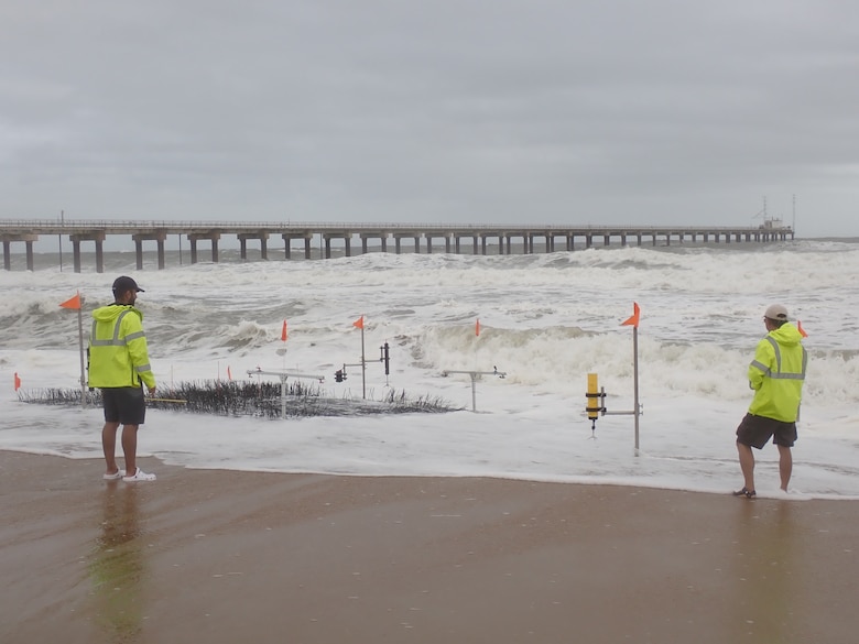 Researchers inspect their equipment during a coastal storm event on the Outer Banks of North Carolina, October 10, 2021. The experiment is part of the U.S. Coastal Research Program’s During Nearshore Event Experiment, or DUNEX, a multi-agency, collaborative initiative to study coastal processes during coastal storms.
