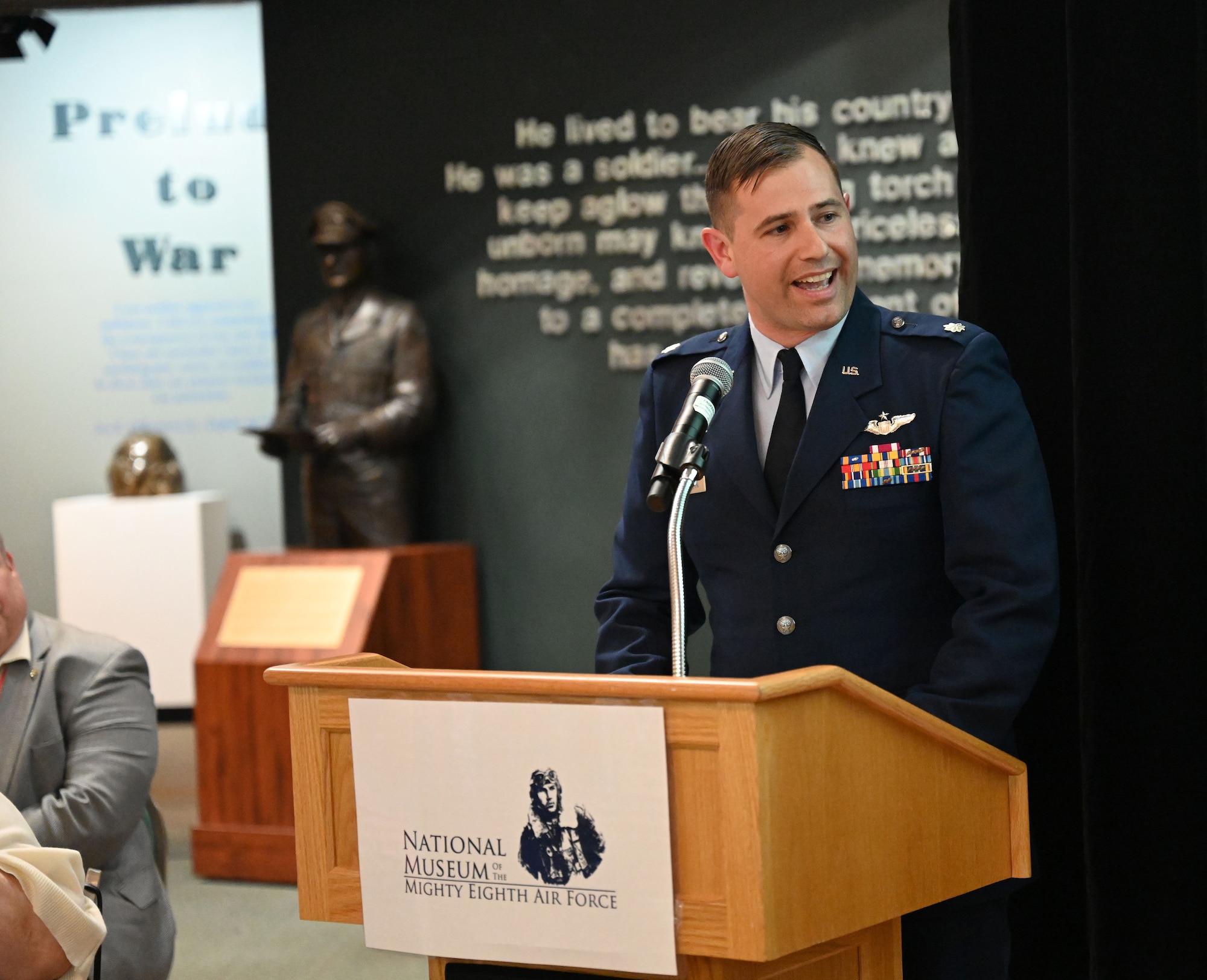 U.S. Air Force Lt. Col. Ryan Chamberlin, 100th Operations Support Squadron assistant director of operations and KC-135 Stratotanker instructor pilot, talks about the historic relationship between the 100th Bomb Group and 100th Air Refueling Wing at the 100th BG reunion banquet at the National Museum of the Mighty Eighth Air Force in Savannah, Georgia, May 27, 2023. Airmen from the 100th ARW attended the reunion to meet veterans and their families, and learn more about the heritage of their wing. (U.S. Air Force photo by Karen Abeyasekere)