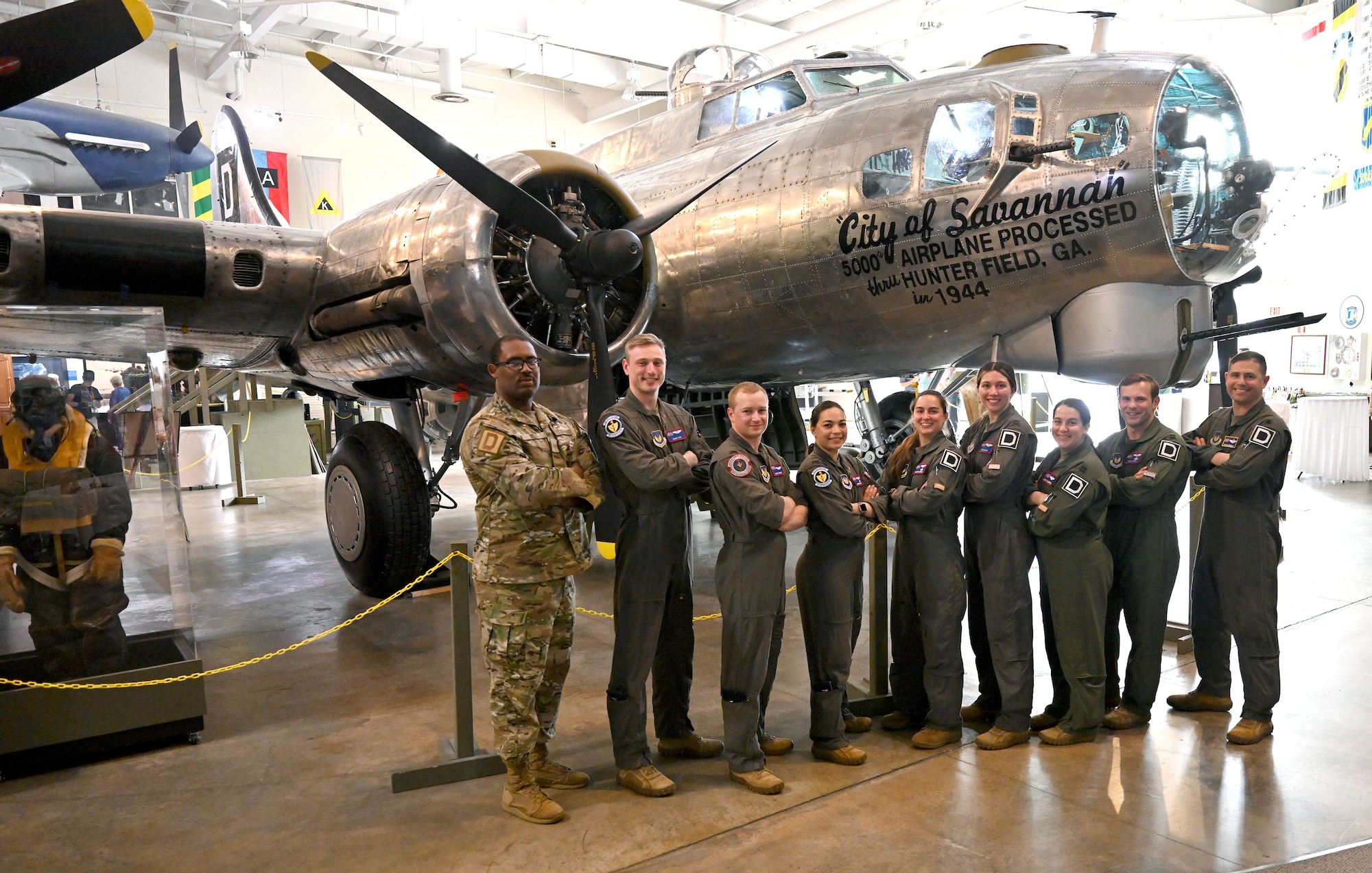 Airmen from the 100th Air Refueling Wing at Royal Air Force Mildenhall, show today’s Air Force with a B-17 Flying Fortress, “The City of Savannah,” originally flown by U.S. Army Air Force Airmen during World War II, at the 100th Bomb Group reunion, National Museum of the Mighty Eighth Air Force, Savanna, Georgia, May 25, 2023. They attended the reunion and met veterans and their families, to learn more about the heritage of their wing.(U.S. Air Force photo by Karen Abeyasekere)