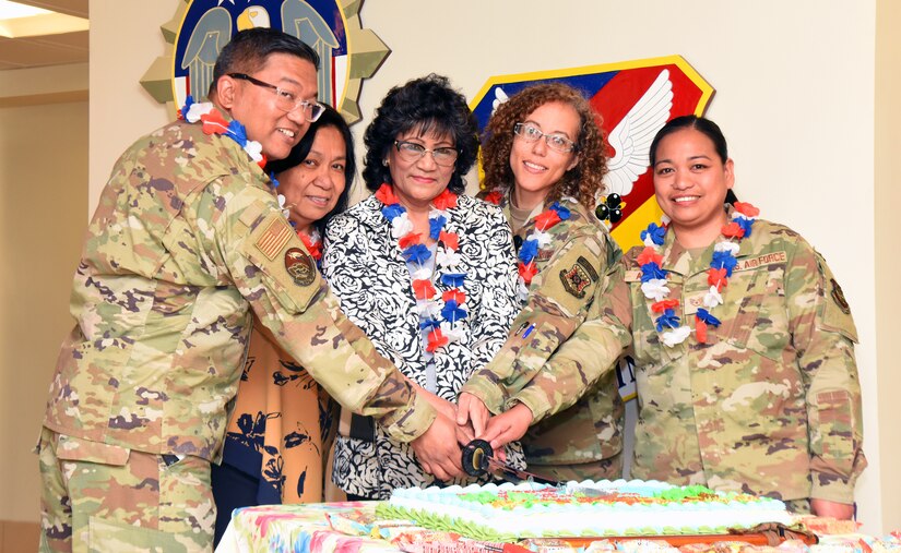 Gloria Basa, 87th Civil Engineering Group executive officer, poses with Felicitas Shuler, 373rd Training Squadron information systems manager, and the Asian American Native Hawaiian Pacific Islander committee at the AANHPI heritage month kick-off ceremony at 87th Air Base Wing lobby on Joint Base McGuire-Dix-Lakehurst, N.J., May 1, 2023. JB MDL celebrated AANHPIH month to honor U.S. military servicemembers and veterans, and civilians of Asian, Native Hawaiian, and Pacific Islander descent for their years of countless contributions to the armed forces. (U.S. Air Force photo by Daniel Barney)