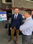 IMAGE: Virginia Tech student Kevin Matos talks with Dale Sisson, Jr., SES, Naval Surface Warfare Center Dahlgren Division Technical Director, at the Virginia Tech Mechanical Engineering Senior Design Expo in April.