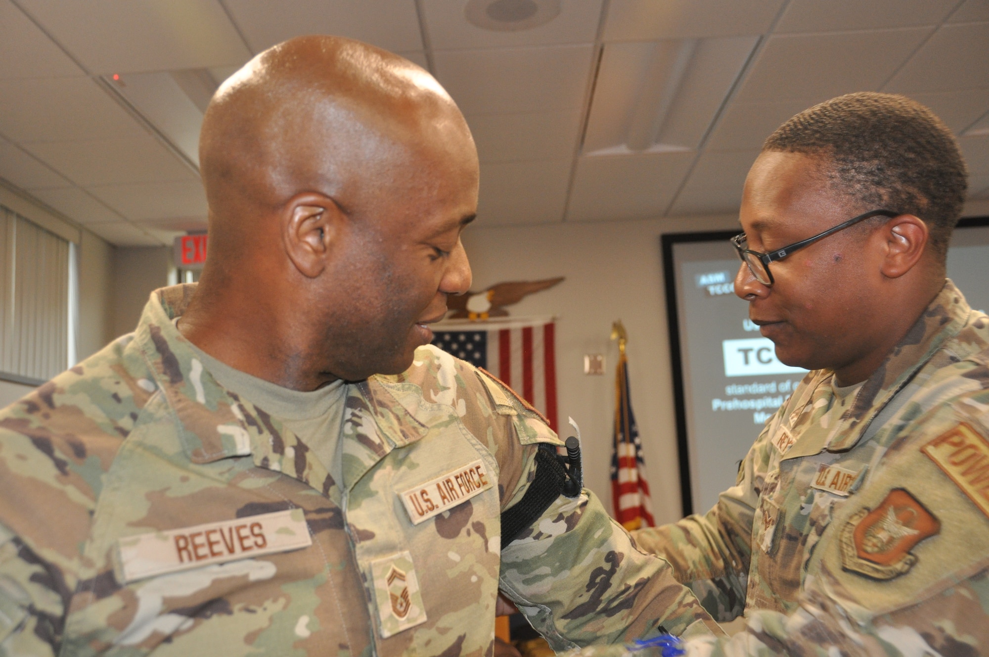 two men practice medical skills