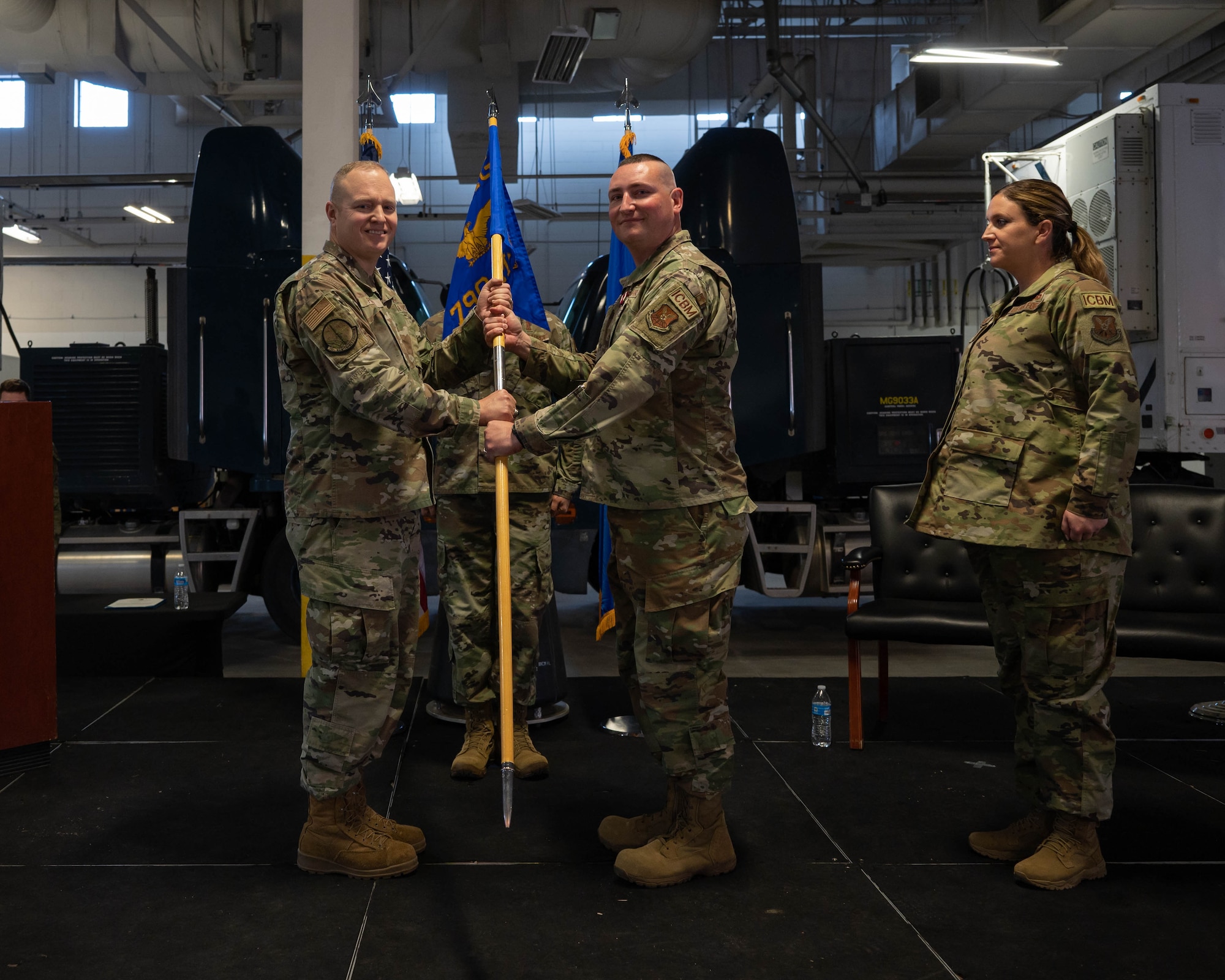 Outgoing 790 MXS commander passes the guidon to 90 MXG commander