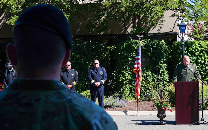 U.S. Air Force Maj. Patrick Livingstone, 9th Security Forces Squadron commander, listens to Sheriff Wendell Anderson give the perpetual roll call during the 2023 Regional Peace Officers’ Memorial Ceremony, May 17, 2023, in Yuba City, California.