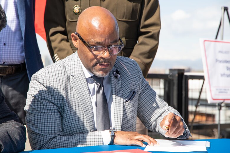 Denver Mayor Michael B. Hancock signs the Public Partnership Agreement for the South Platt River Tributary Waterway Restoration Project in Denver, CO.