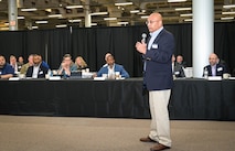 Photo of Deputy Assistant Secretary of Defense for Materiel Readiness Dr. Vic Ramdass addressing the audience.