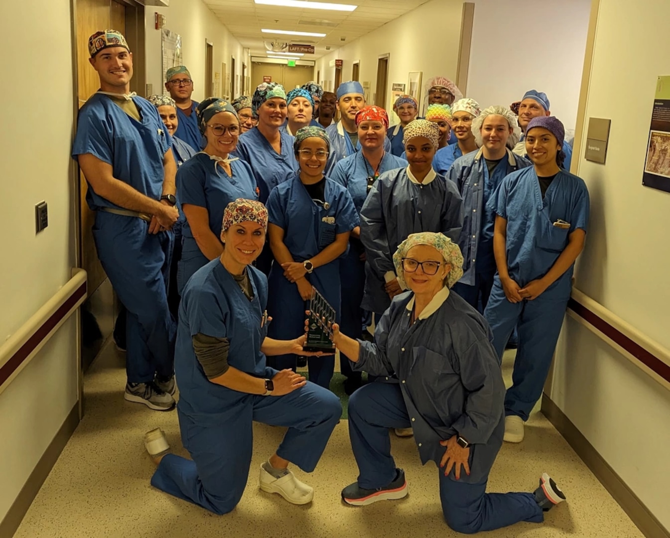 Womack Army Medical Center Department of Surgery Team pose with Center of Excellence in Surgical Safety: Prevention of RSI award on May 30. The Association of PeriOperative Registered Nurses (AORN) recognized WAMC as the first military facility to receive this prestigious award.