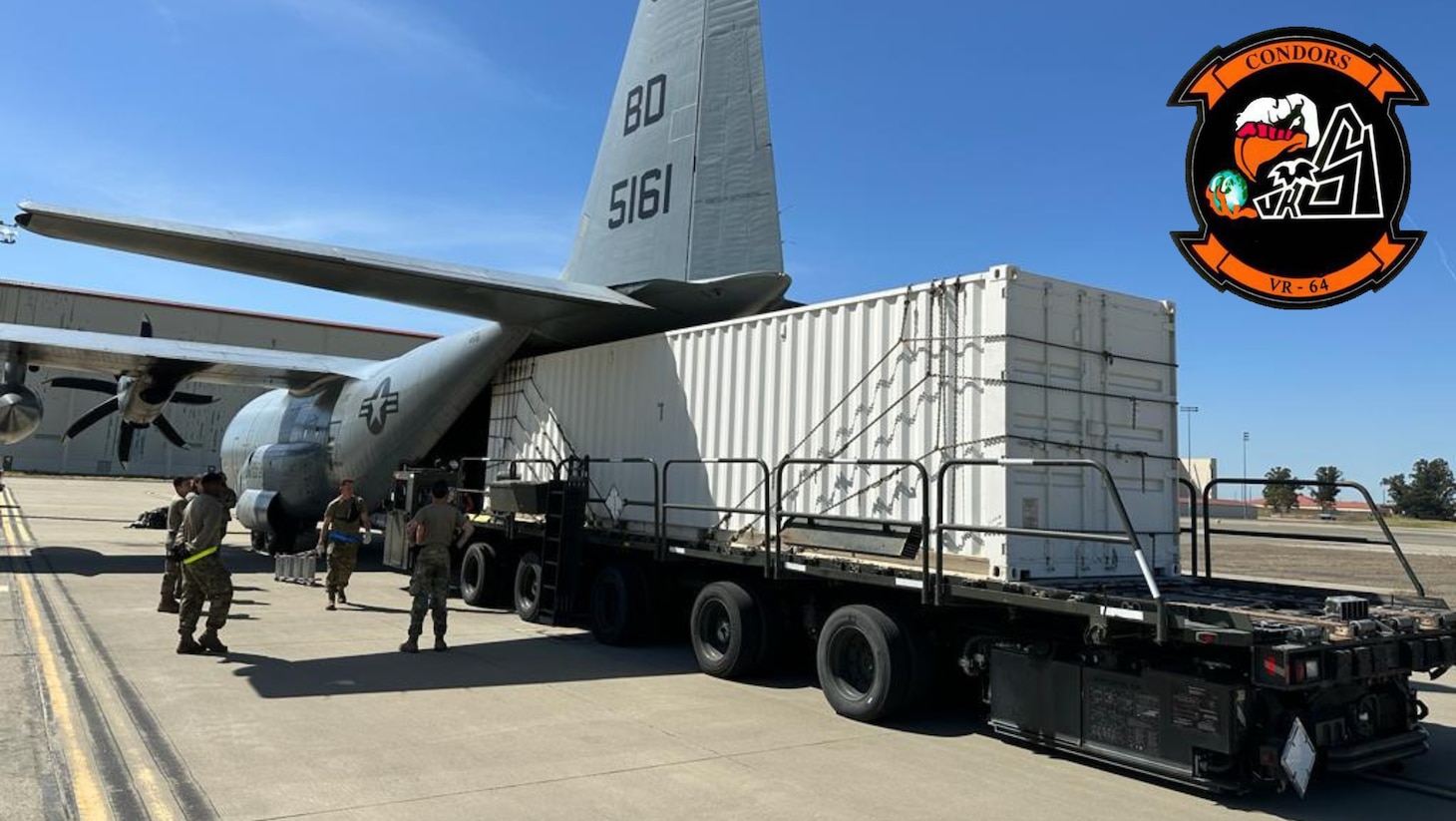 A mobile SCIF is loaded onto a K/C-130T Hercules assigned to VR-64