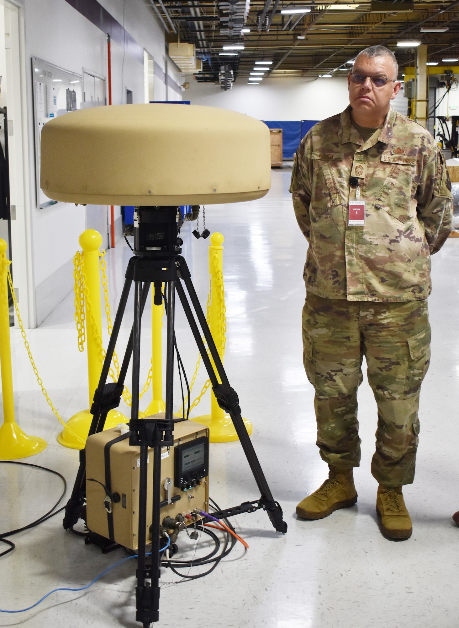 Chief Master Sgt. Steven Bauch, U.S. Air Forces in Europe’s functional manager for radar, airfield and weather systems, examines a man-portable Tactical Air Navigation at the Thales facility in Salt Lake City. The Air Force has recently signed a contract with Thales to purchase six man-portable TACAN systems to be used overseas.