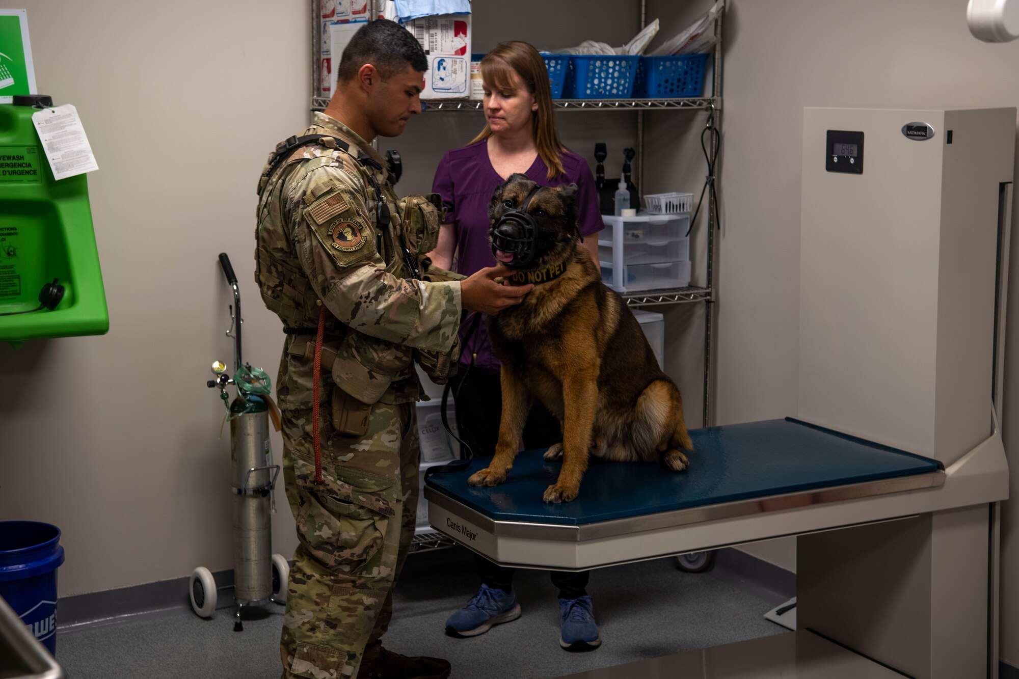 Senior Airman Joseph Fox, 22nd Security Forces Squadron military working dog handler, calms his military working dog Sani as she is prepped for an eye exam at the veterinary clinic May 30, 2023, at McConnell Air Force Base, Kansas. This exam is part of the American College of Veterinary Ophthalmologist/Epicur Pharma’s National Service Animal Eye Exam, which provides free eye exams for military working dogs to identify abnormalities that could affect vision and ability to perform their duties. (U.S. Air Force Photo by Airman Gavin Hameed)