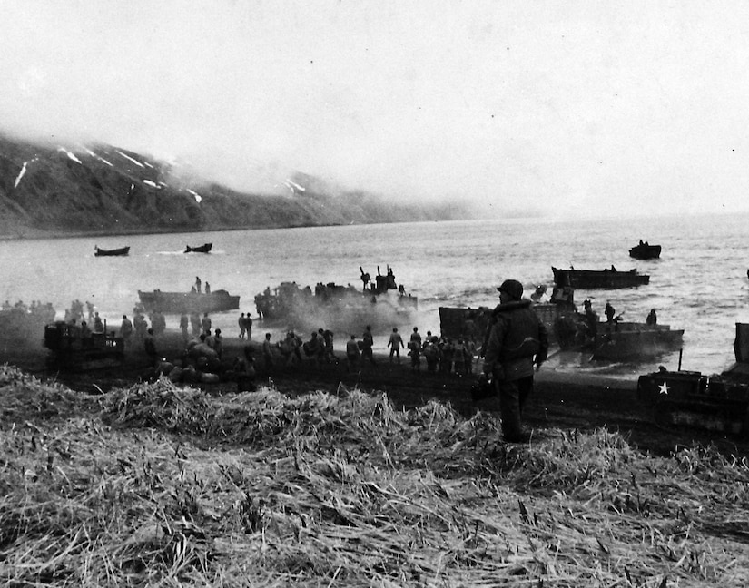 Army landing craft unloading troops and supplies at Massacre Bay, 12 May 1943.