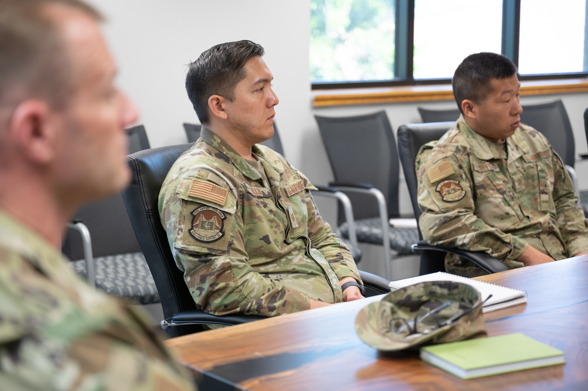 Two members during a group interview with other 349 FSS members. The Airmen are part of the team who was awarded the Force Support Wartime Readiness Legacy Award for 2022.