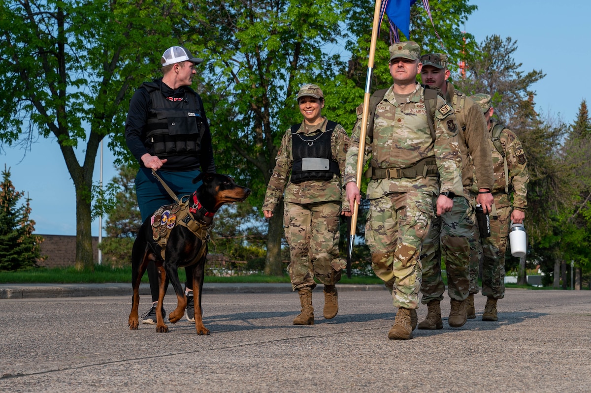 Members of the 934th Airlift Wing march in formation as part of a 12-hour ruck to remember the fallen during National Police Week 2023 at the Minneapolis-St. Paul Air Reserve Station, May 19, 2023. National Police Week 2023 was held from May 14th to May 20th to honor those who have served and are currently serving in the Law Enforcement profession. (U.S. Air Force photo by Senior Airman Matthew Reisdorf)