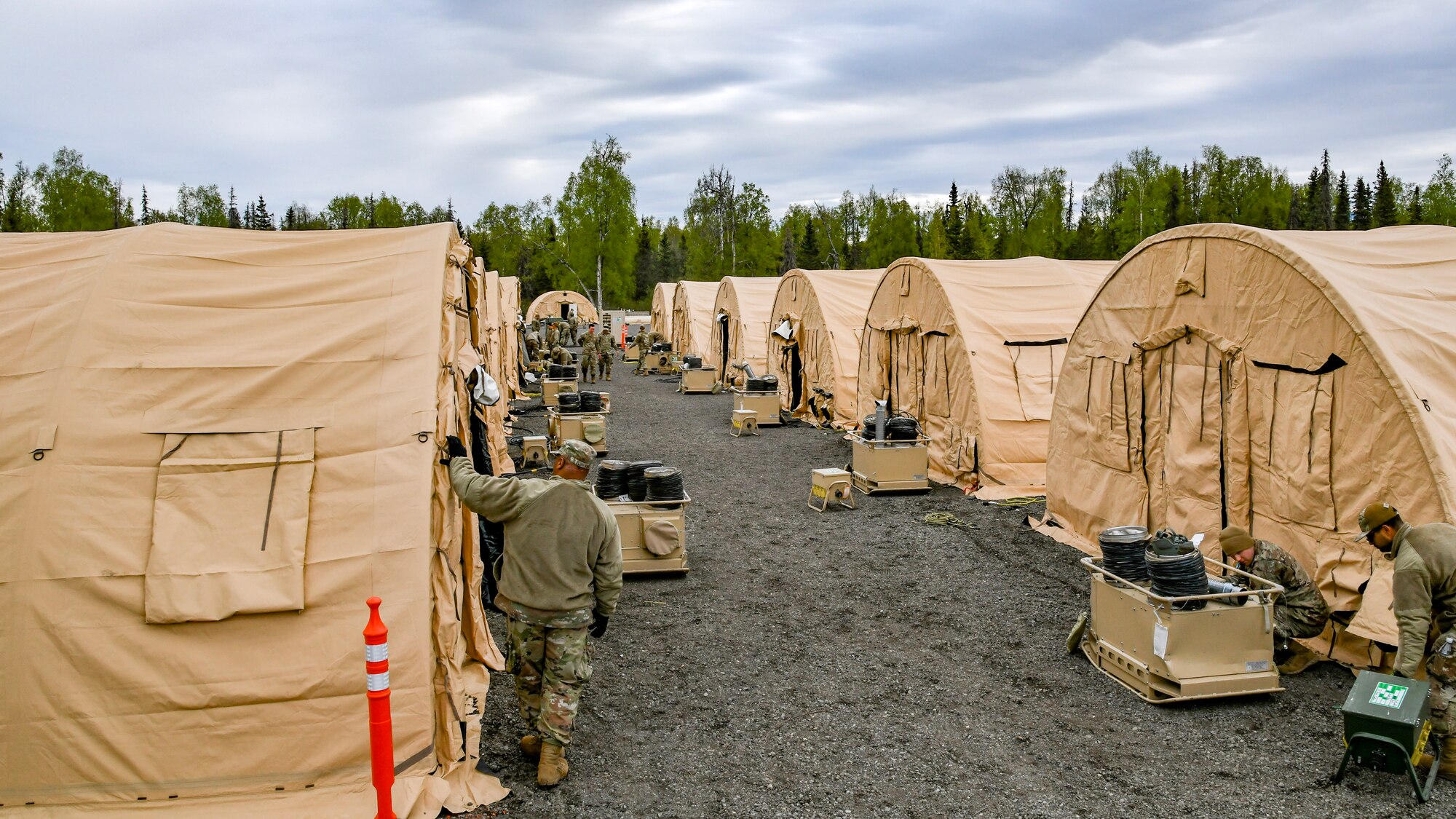 A photo of Airmen of the 177th, 108th, and 111th Civil Engineer Squadrons breaking down equipment and living quarters to conclude Scruffy Devil.