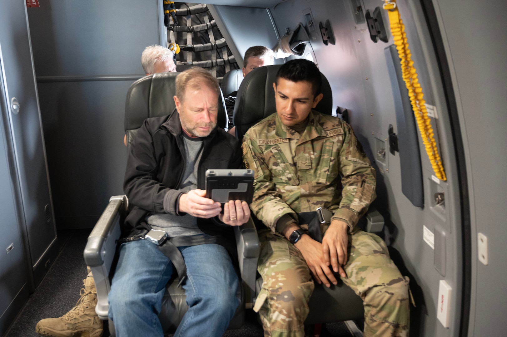 Airman and employer sit on a KC-46