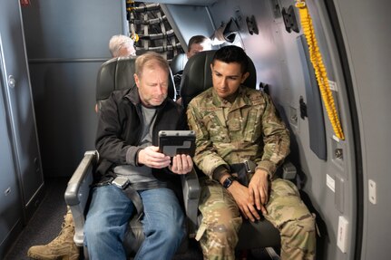 Airman and employer sit on a KC-46