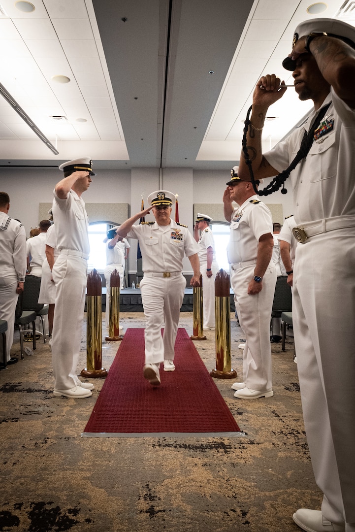 Capt. Sean Barbabella, center, Commander of Naval Health Clinic Cherry Point, salutes as he is piped aboard during the facility’s change of command ceremony May 31, 2023.  Barbabella assumed command of the clinic from Capt. Elizabeth Adriano during the ceremony.