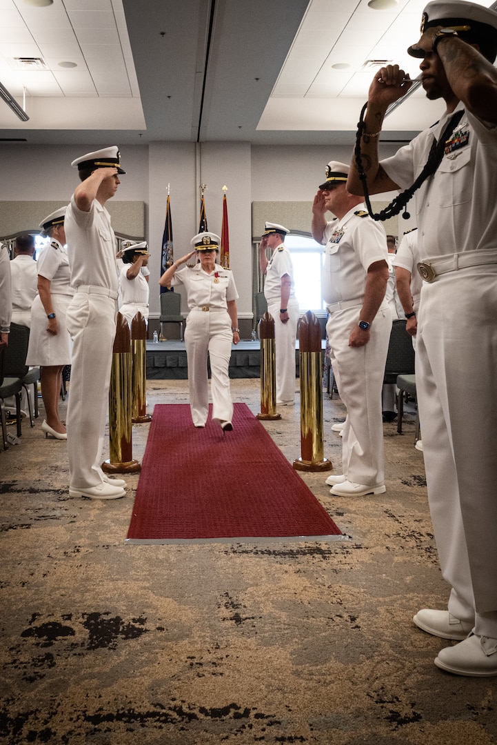 04-	Capt. Elizabeth Adriano, center, salutes as she is piped ashore during the Naval Health Clinic Cherry Point change of command ceremony May 31, 2023 aboard Marine Corps Air Station Cherry Point.  Adriano relinquished command of the clinic to Capt. Sean Barbabella during the ceremony.