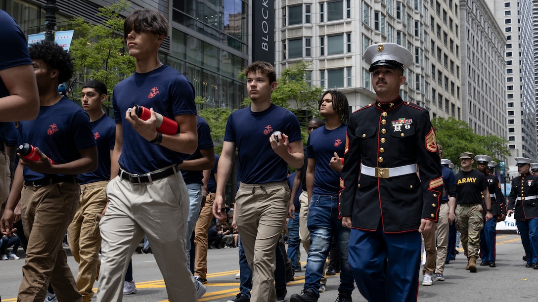 U.S. Marines with Marine Corps Recruiting Station Chicago, 9th Marine Corps District, attend Chicago's Memorial Day Parade, Chicago, IL, May 27, 2023. The Memorial Day parade is a way the honor those who have made the ultimate sacrifice for our Nation. During the parade applicants from all branches of the armed forces raised their right hands and spoke the Oath of Enlistment. (U.S. Marine Corps photo by Sgt. Dalton J. Payne)