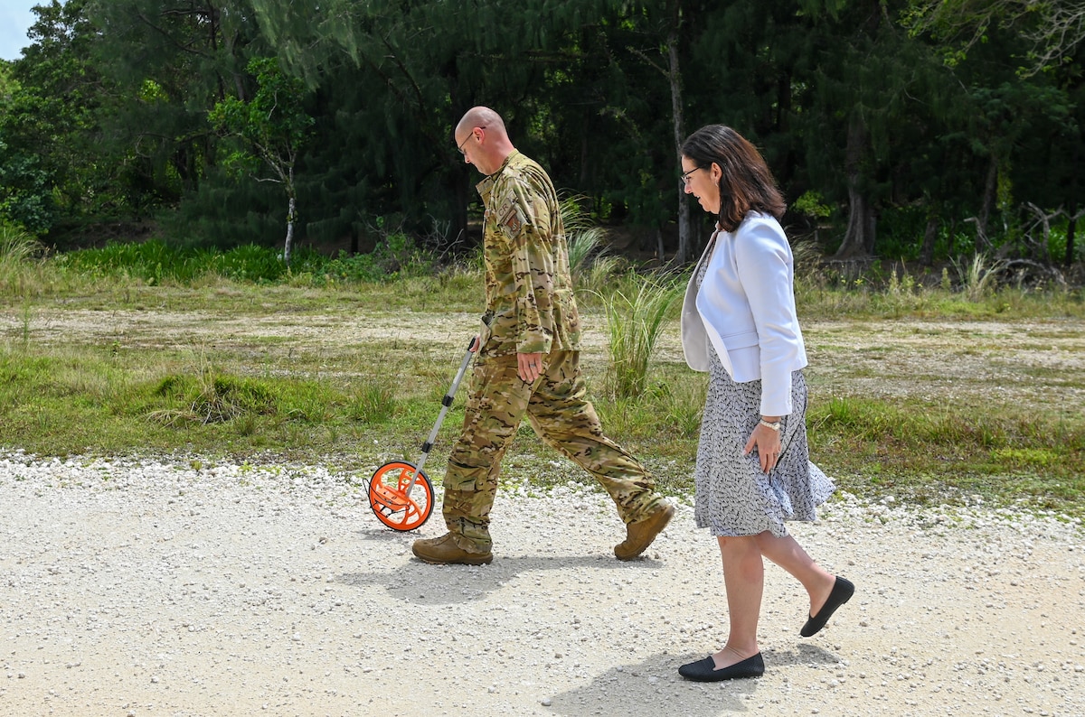 U.S. Air Force Col. Richard McElhaney, 36th Contingency Response Group commander, does a walking tour with Honorable Kristyn E. Jones, performing the duties of undersecretary of the Air Force (USecAF), at the Pacific Regional Training Center-Andersen, Guam, May 6, 2023. McElhaney showed Jones the measurements needed for a new flightline and discussed upcoming projects at the Pacific Regional Training Center-Andersen. (U.S. Air Force photo by Airman 1st Class Allison Martin)