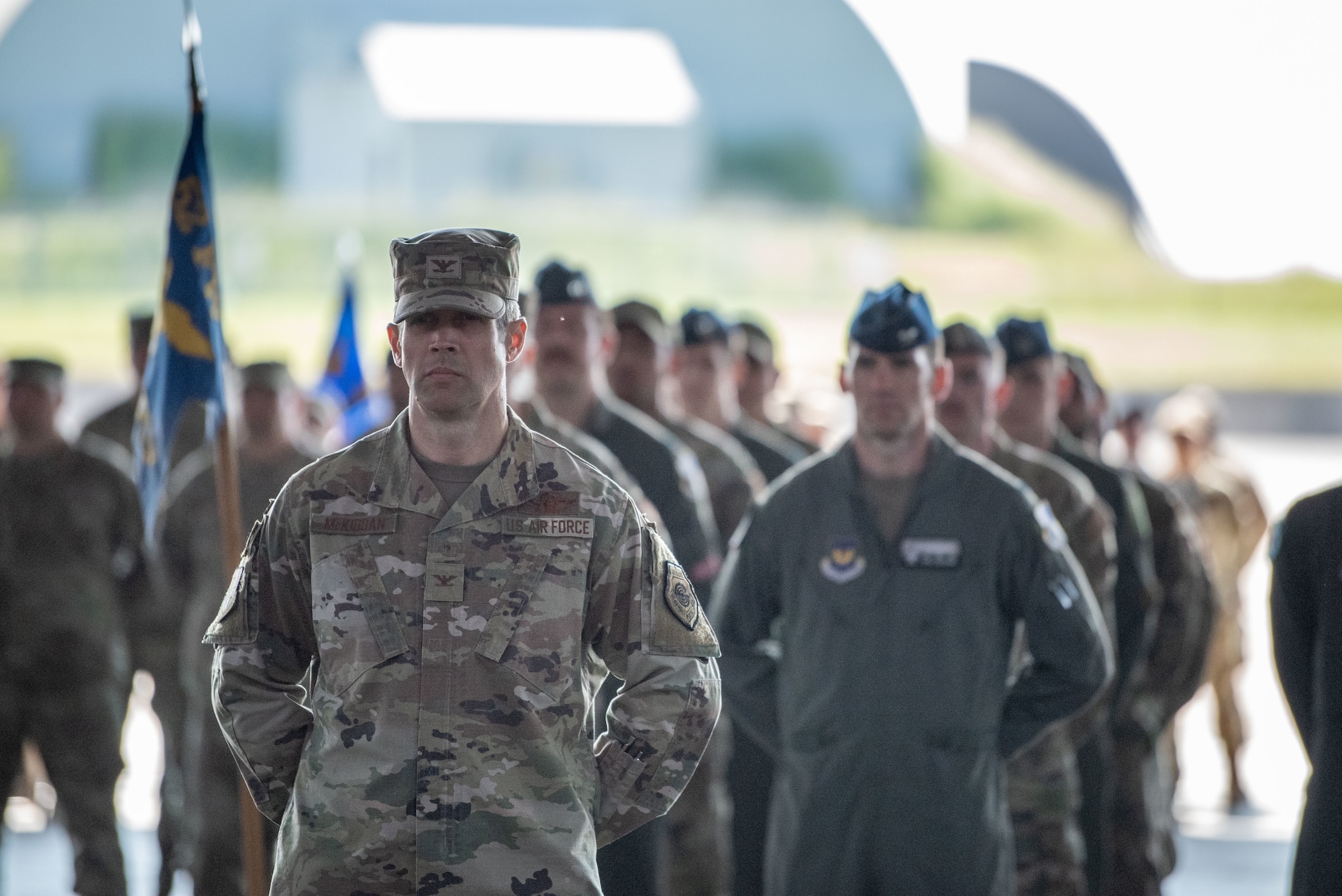 U.S. Air Force Col. William McKibban, 52nd Fighter Wing vice commander, stands at parade rest in front of a formation for the 52nd FW Change of Command ceremony