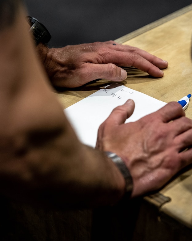 An Airman keeps track of his work out as part of the Murph Challenge.