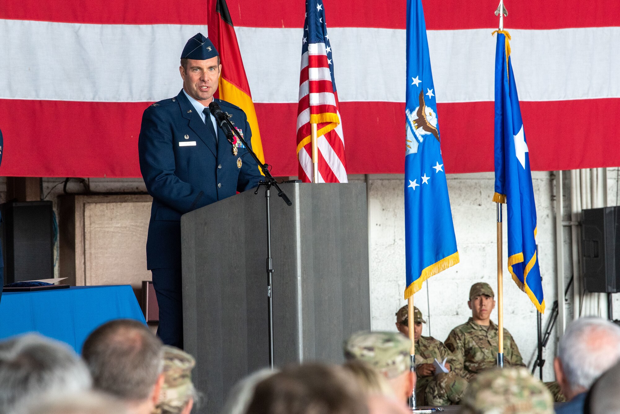 U.S. Air Force Col. Leslie Hauck, 52nd Fighter Wing outgoing commander, makes his final remarks during the 52nd FW change of command ceremony