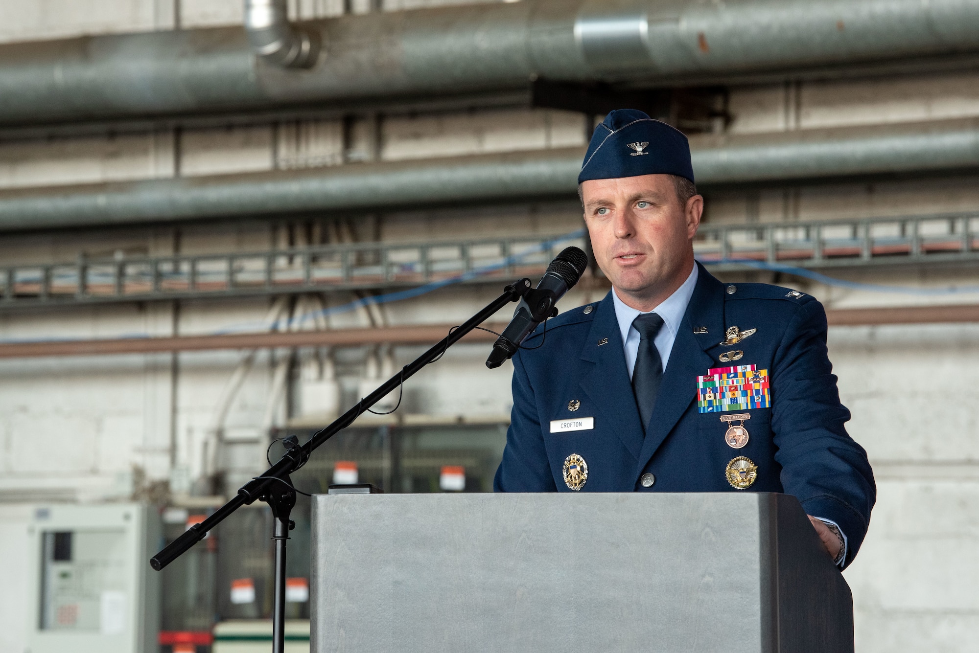 U.S. Air Force Col. Kevin Crofton, 52nd Fighter Wing incoming commander, gives his first remarks during the 52nd FW change of command ceremony