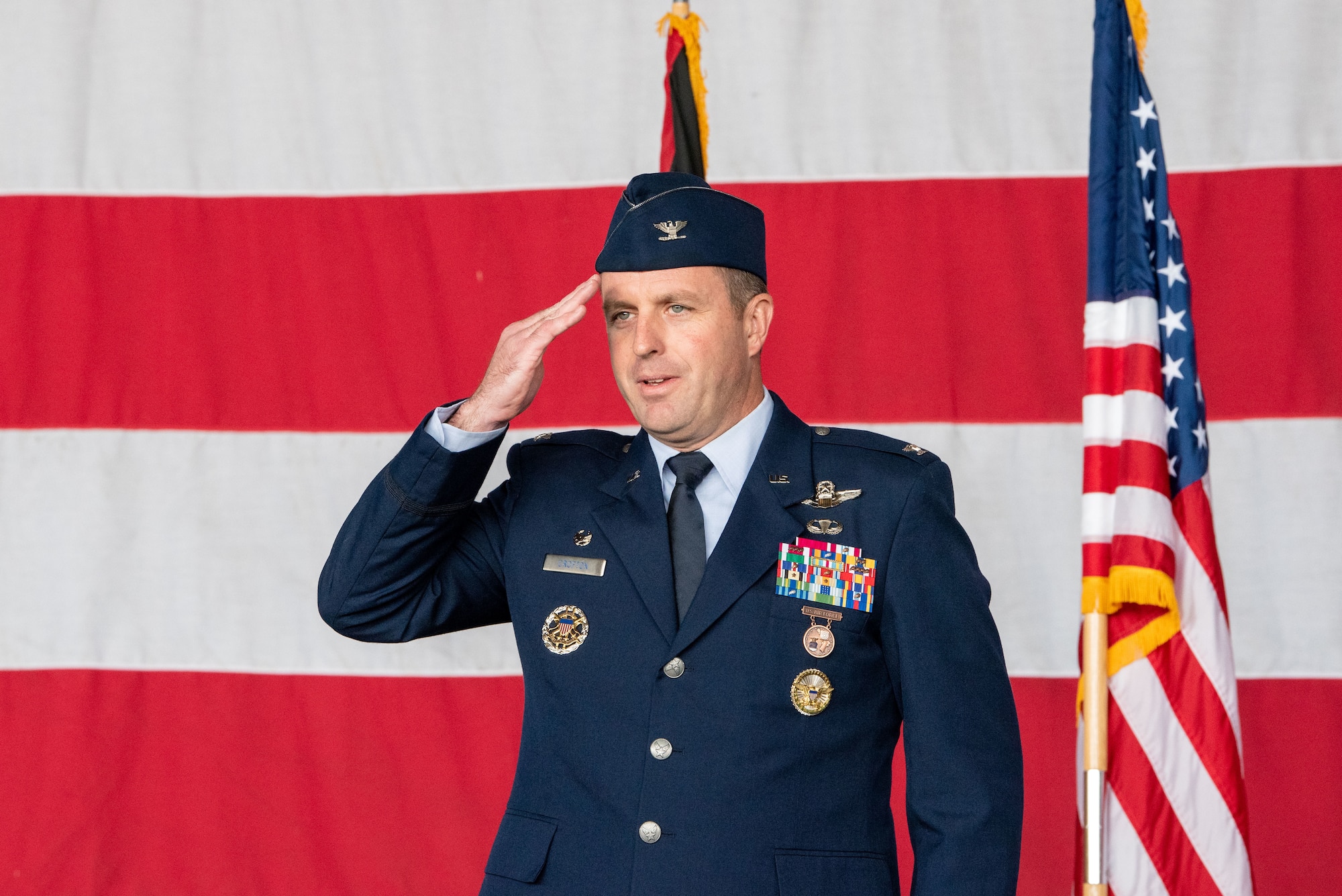 U.S. Air Force Col. Kevin Crofton, 52nd Fighter Wing incoming commander, renders his first salute during the 52nd FW change of command ceremony