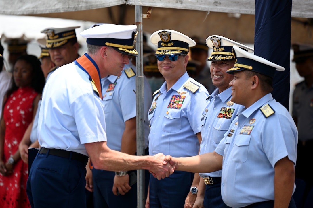 Capt. Brian Krautler, commanding officer of U.S. Coast Guard Cutter Stratton (WMSL 752), is greeted by Philippine Coast Guard senior leadership following Stratton’s arrival to Manila, Philippines, for a tri-lateral engagement with the Philippine and Japan Coast Guards, June 1, 2023. Stratton deployed to the Western Pacific under U.S. Navy 7th Fleet command to serve as a non-escalatory asset for the promotion of a rules-based order in the maritime domain by engaging with partner nations and allies in the region. (U.S. Coast Guard photo by Chief Petty Officer Matt Masaschi)