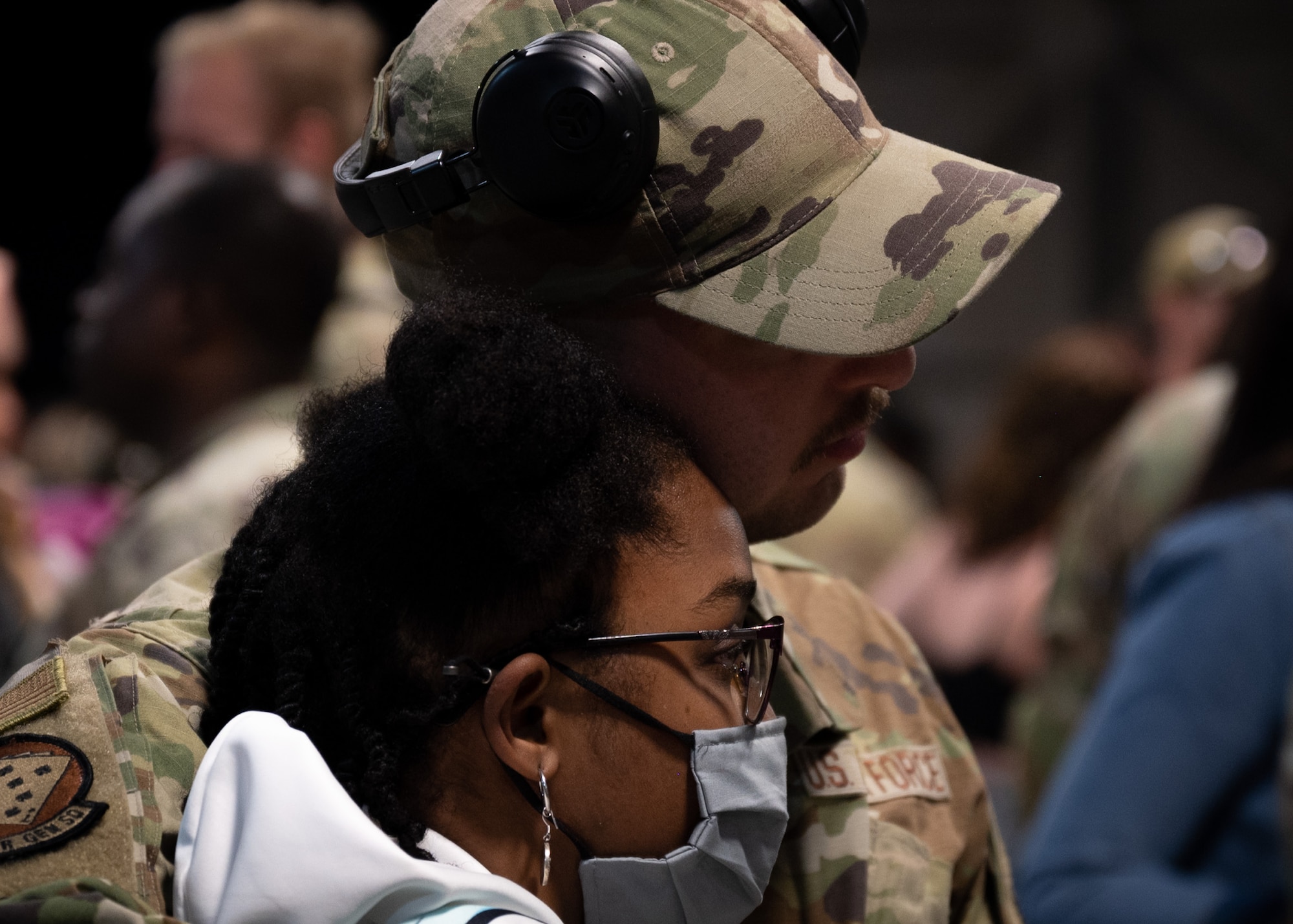 An Airman hugs his significant other after returning to Shaw Air Force Base.