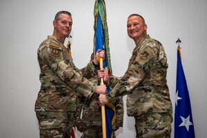 Photo of people holding a flag