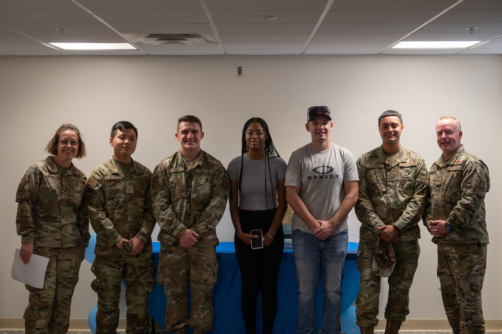Members of the 6th Air Refueling Wing pose for a photo during a dormitory reopening ceremony at MacDill Air Force Base, Florida, June 1, 2023.