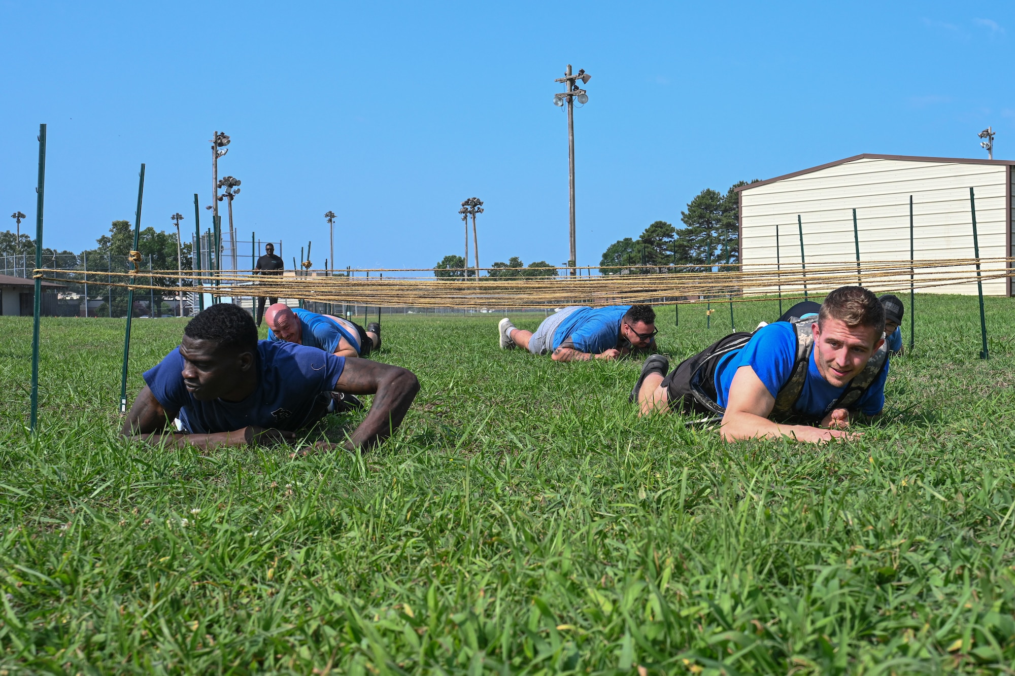 Airmen participate in an obstacle course.