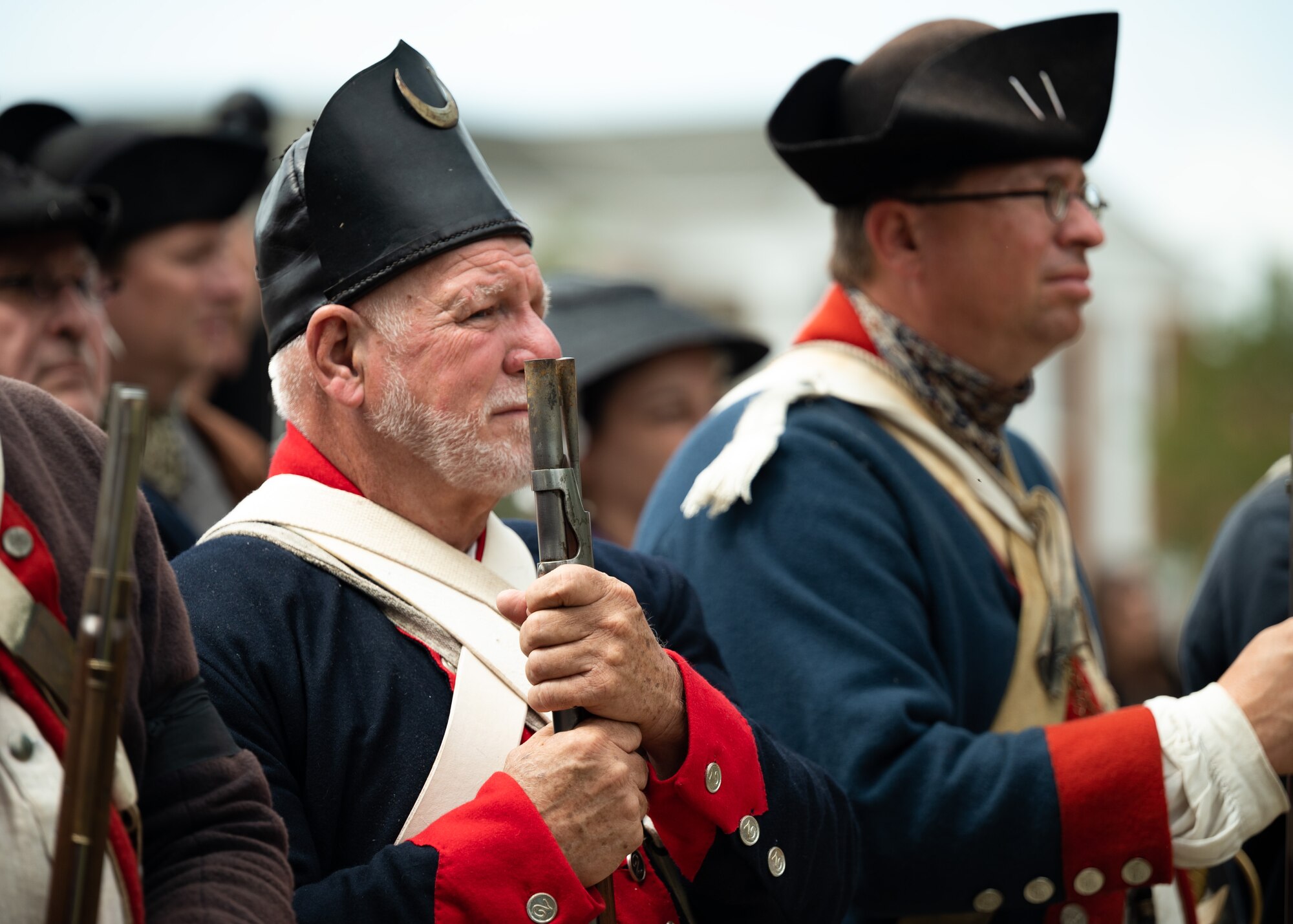 Revolutionary War reenactors pay tribute during funeral service for fallen Revolutionary War soldiers.