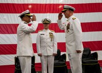 230602-N-KC543-1265 NORFOLK (June 2, 2023) Rear Adm. Brendan McLane, commander, Naval Surface Force Atlantic, right, turns over command with Rear Adm. Joseph Cahill, commander, SURFLANT, during the SURFLANT change of command ceremony aboard the amphibious assault ship USS Wasp (LHD 1), June 2, 2023. During the ceremony, Cahill relieved McLane as commander SURFLANT. (U.S. Navy photo by Mass Communication Specialist 1st Class Alora R. Blosch)