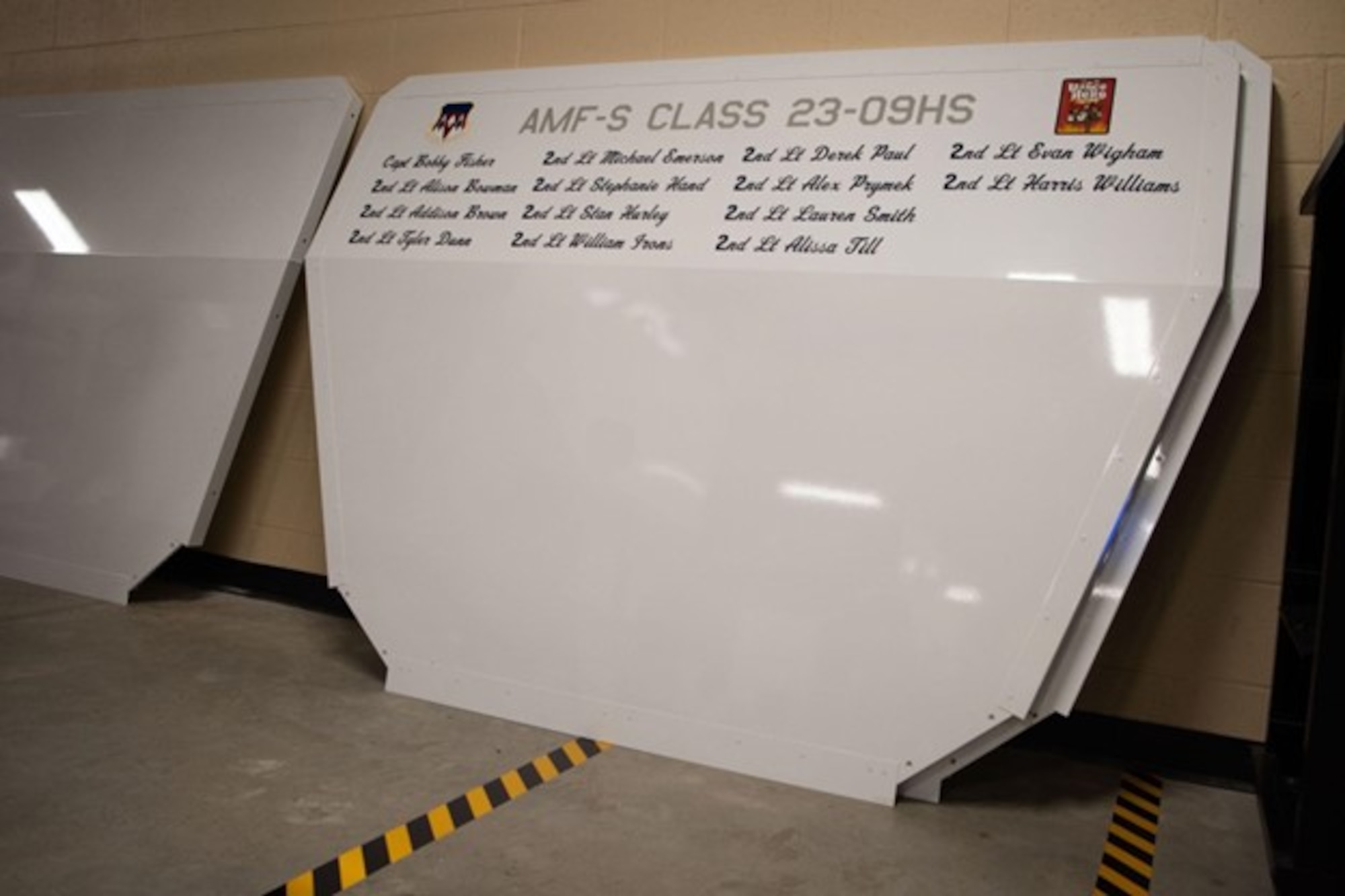 Names of each student on a nose cone of a aircraft from the first AMF-S class at Vance