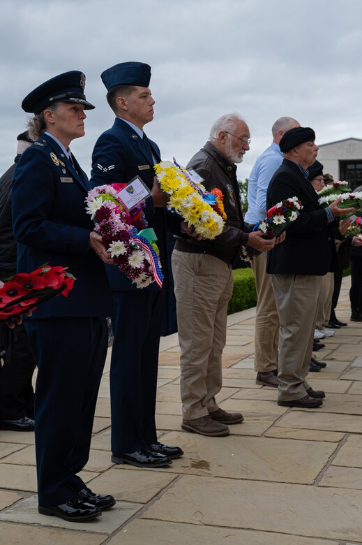 U.S. Air Force Col. Elizabeth Hanson, 305th Air Mobility Wing Commander, and U.S. Air Force Airman 1st Class Jesse Harrelson, 6th Airlift Squadron Loadmaster, prepare to lay commemorative wreaths.