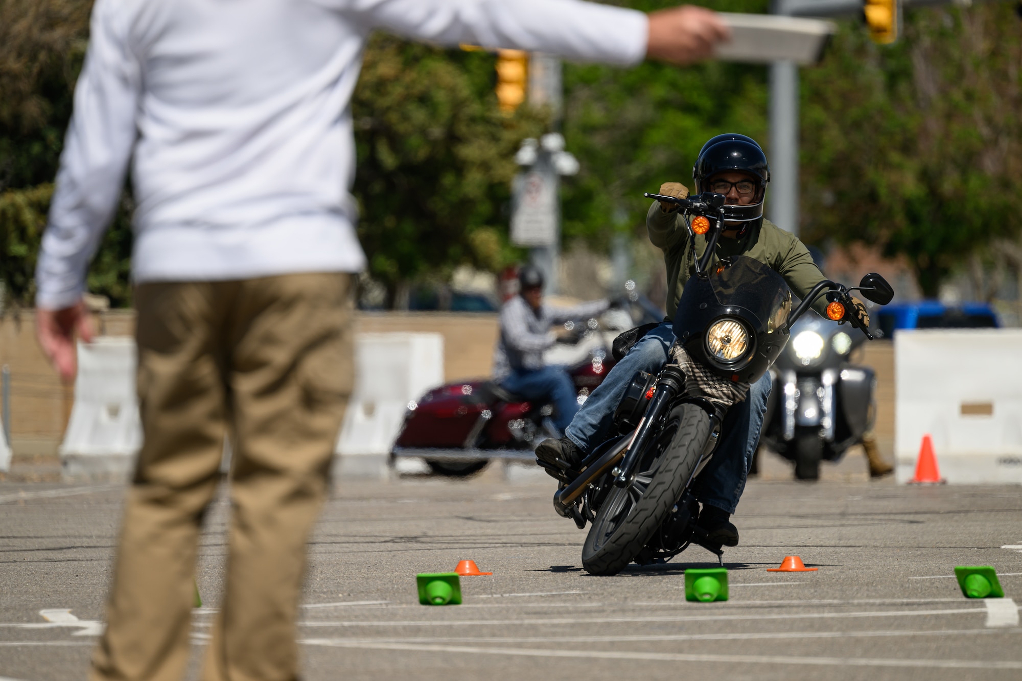 Julian Leija swerves an obstacle during a Basic Rider Course at Hill Air Force Base, Utah, May 26, 2023. The 75th Air Base Wing safety office maintains a SharePoint that provides motorcyclists with information and resources regarding safety, requirements and training for anyone with base access.  (U.S. Air Force photo by R. Nial Bradshaw)