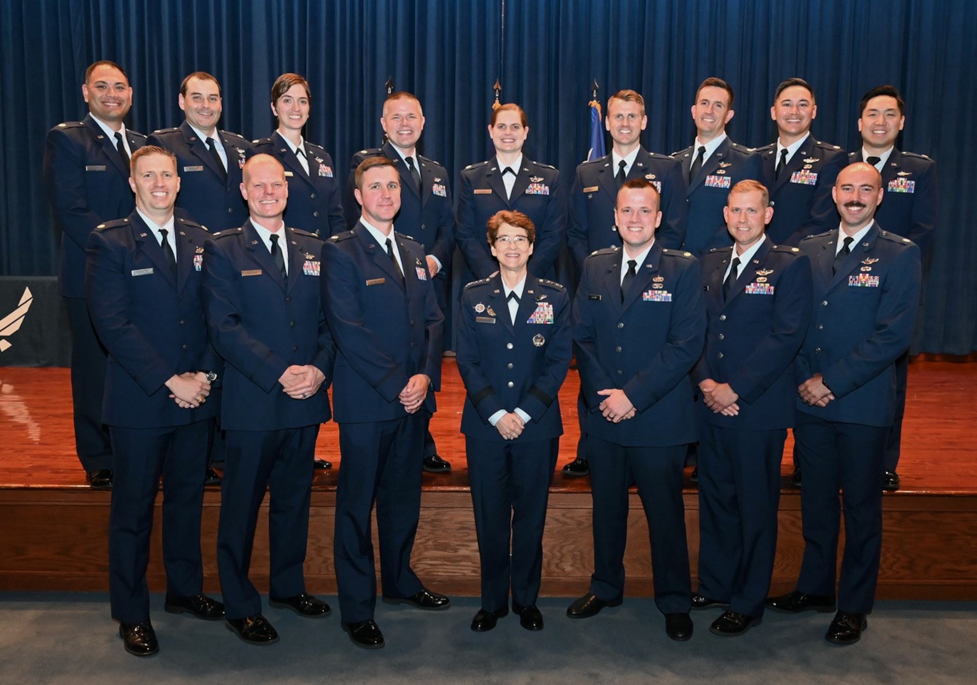 The Advanced Study of Air Mobility (ASAM) class of 2023 poses for a group photo with keynote speaker U.S. Air Force Gen. Jacqueline Van Ovost, U.S. Transportation Command commander.