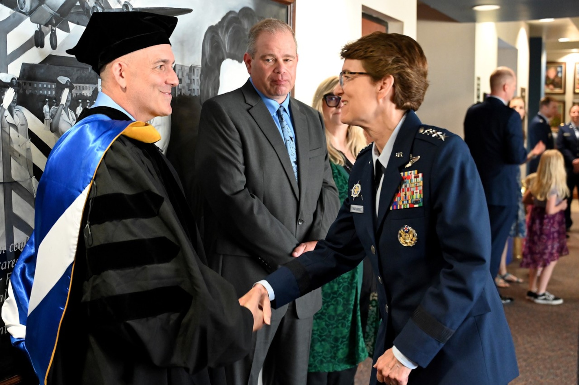 U.S. Air Force Gen. Jacqueline Van Ovost, U.S. Transportation Command commander presented coins to a few key members who are instrumental in the success of ASAM