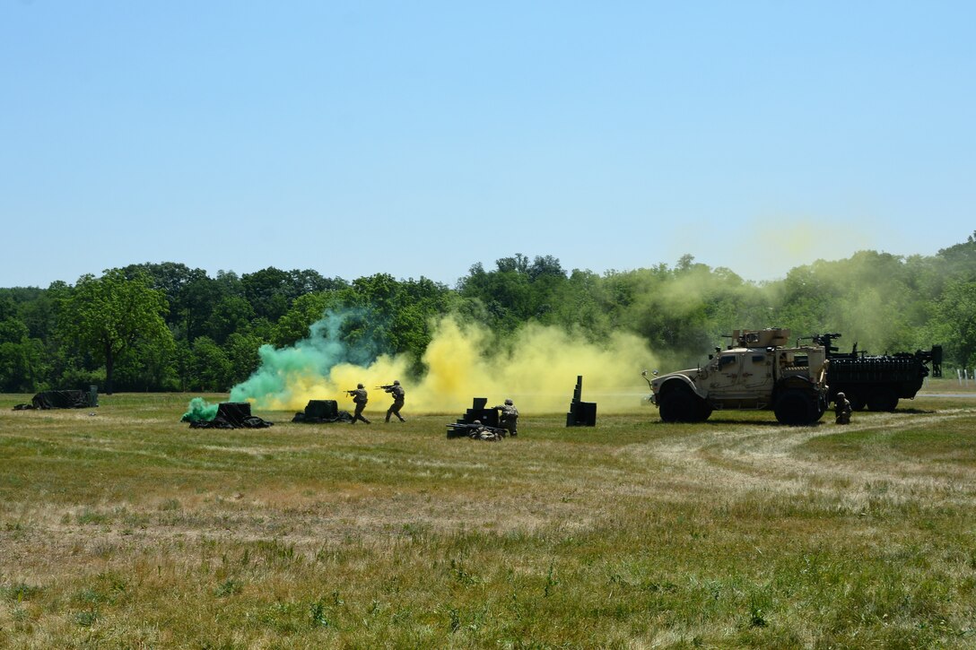 The Pennsylvania Army National Guard Ambassador Demonstration Team performs a live-action demonstration May 31, 2023, at Fort Indiantown Gap, Pa. The 15-member team was recently formed to travel across the state to different events to help raise awareness of the National Guard and aid recruiting. (Pennsylvania National Guard photo by Brad Rhen)