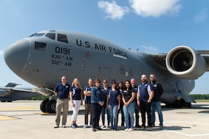 Team Dover honorary commanders pose for a photo next to a C-17 Globemaster III at Dover Air Force Base, Delaware, May 31, 2023. During their tour, the honorary commanders visited 436th Mission Generation Group units and interacted with Airmen to learn more about the 436th MGG mission. (U.S. Air Force photo by Roland Balik)