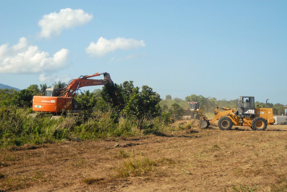 U.S. Navy Sailors assigned to Amphibious Construction Battalion 1 operate heavy machinery equipment to clear land for the life sustaining area utilized during a combined joint logistics over the shore operation in preparation for Balikatan 23 in Casiguran, Philippines, March 23, 2023. Balikatan is an annual exercise between the Armed Forces of the Philippines and U.S. Military designed to strengthen bilateral interoperability, capabilities, trust, and cooperation built over decades of shared experiences. (U.S. Navy photo by Ensign Brianna Curley)