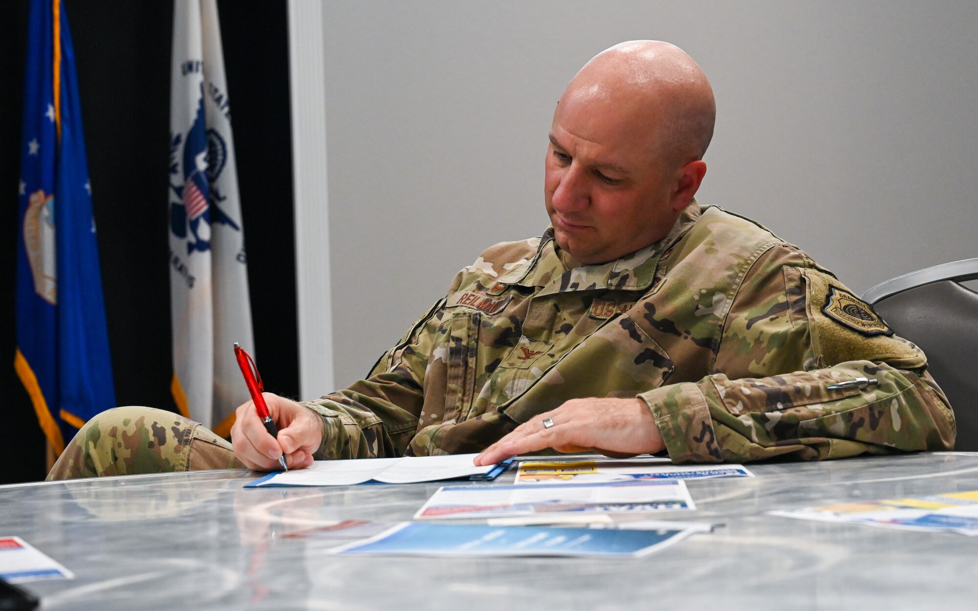U.S. Air Force Col. Matthew Reilman, 17th Training Wing commander, takes notes during the resident town hall meeting, Goodfellow Air Force Base, Texas, May 24, 2023. The event covered a variety of topics and answered questions on multiple housing concerns. (U.S. Air Force photo by Airman 1st Class Zachary Heimbuch)