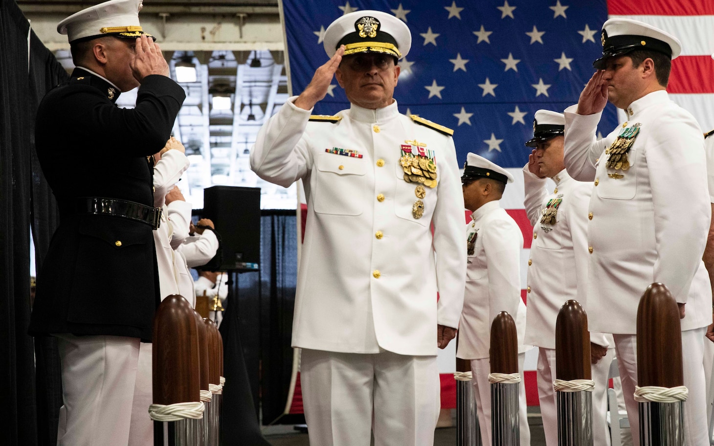 230602-N-KC543-1346 NORFOLK (June 2, 2023) Rear Adm. Joseph Cahill, commander, U.S. Naval Surface Force Atlantic, salutes the side boys during the SURFLANT change of command ceremony aboard the amphibious assault ship USS Wasp (LHD 1), June 2, 2023. During the ceremony, Cahill relieved Rear Adm. Brendan McLane as commander SURFLANT. (U.S. Navy photo by Mass Communication Specialist 1st Class Alora R. Blosch)