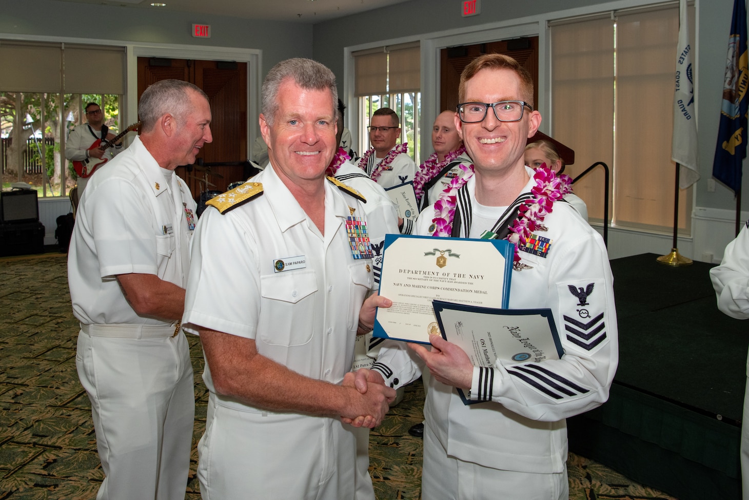 Adm. Samuel Paparo, commander of U.S. Pacific Fleet, poses for a photo with the Sea Sailor of the Year, Operations Specialist 1st Class Matthew Yeager. The SOY program, established in 1972, recognizes those who exemplify a warfighting spirit, the Navy’s core values, and a deep commitment to their commands and communities. (U.S. Navy photo by Mass Communication Specialist 1st Class Nick Bauer)